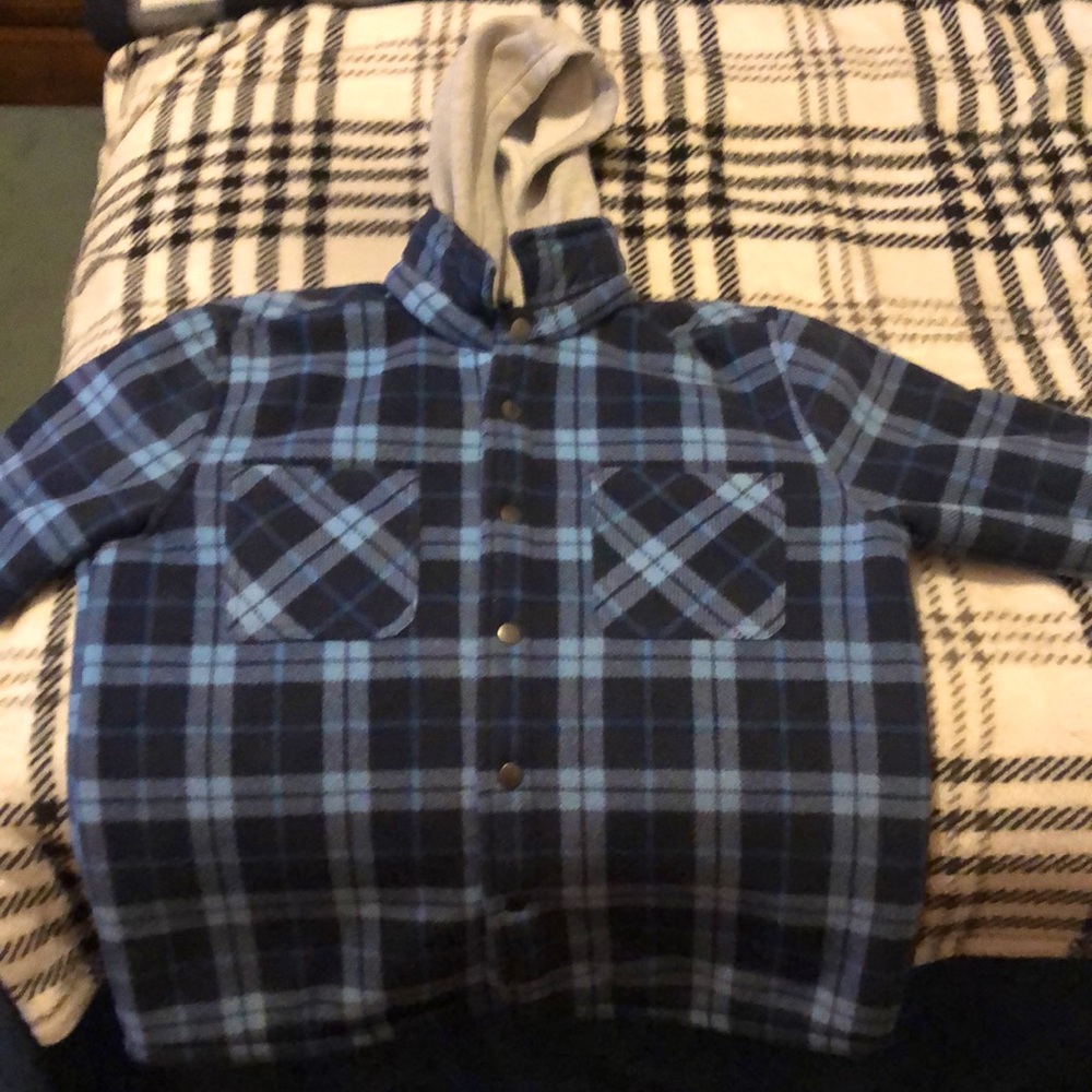 A blue plaid hooded Sherpa lined flannel coat